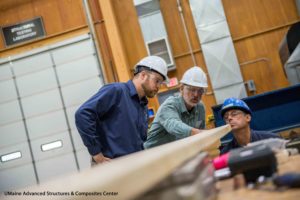 Researchers working at the UMaine Advanced Structures & Composites Center.