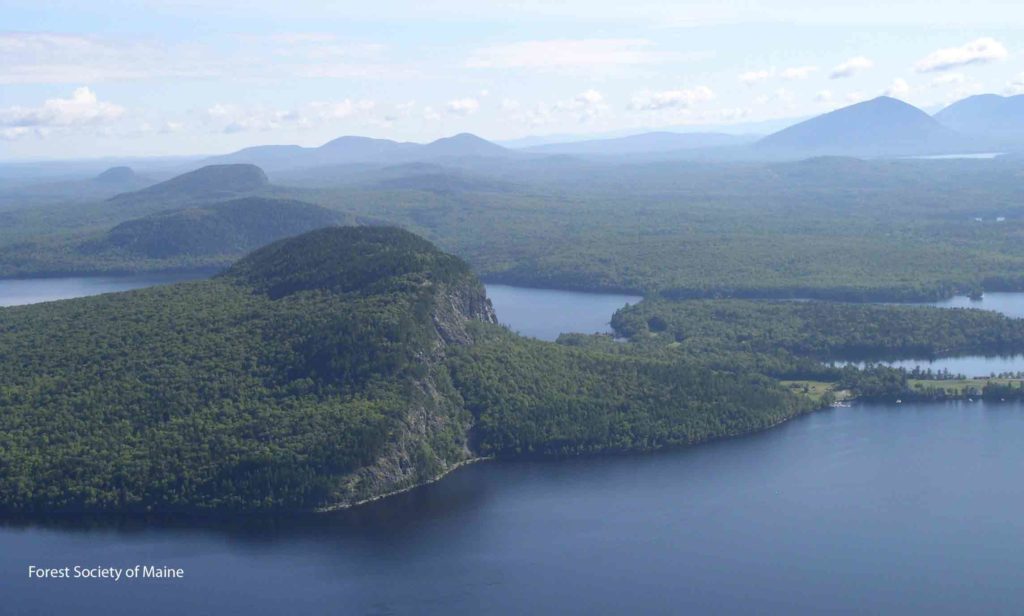 View of Mount Kineo and other conserved forestlands along Moosehead Lake.